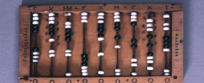 An antique abacus with a wooden frame