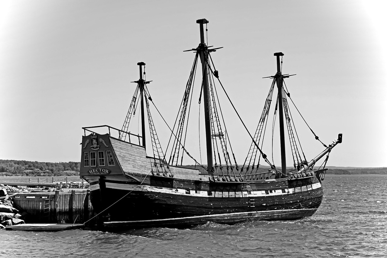 A docked 18th century, three-masted ship